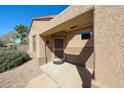 Inviting front porch area with a stylish security door and tiled flooring at 16137 W Quail Creek Ln, Surprise, AZ 85374