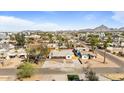 Aerial view of a neighborhood with tree-lined streets and well-maintained homes at 1642 E Turney Ave, Phoenix, AZ 85016