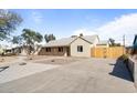 Single-story home with concrete driveway and desert landscaping in front at 1642 E Turney Ave, Phoenix, AZ 85016