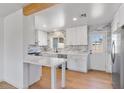 This kitchen features white cabinets, stone countertops, and stainless steel appliances at 1642 E Turney Ave, Phoenix, AZ 85016