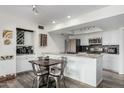 Charming kitchen with stainless steel appliances, granite countertops, and a dining area at 1920 W Lindner W Ave # 277, Mesa, AZ 85202