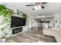 Open-concept living room with stylish fireplace, adjacent to the kitchen area at 1920 W Lindner W Ave # 277, Mesa, AZ 85202