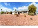 Well-maintained single-story house with desert landscaping, a two car garage, and ample space for parking at 2540 E Riviera Dr, Tempe, AZ 85282