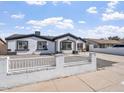 Charming single-story home featuring a well-maintained exterior and a rock front yard at 2609 N 65Th Dr, Phoenix, AZ 85035