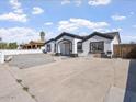Well-maintained single-story home with a gravel front yard and concrete driveway at 2609 N 65Th Dr, Phoenix, AZ 85035