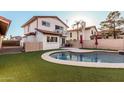 Charming two-story house featuring a backyard pool and patio for entertaining at 4346 E Corral St, Phoenix, AZ 85044