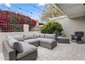 Relaxing outdoor patio area with comfortable seating, string lights, and lush surroundings at 4800 N 68Th St # 225, Scottsdale, AZ 85251