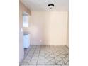 Cozy dining area features tiled floors, neutral walls, and modern lighting fixture at 5316 W Lynwood St, Phoenix, AZ 85043