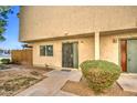 Charming townhouse exterior with well-maintained landscaping and secure entry at 5962 W Townley Ave, Glendale, AZ 85302