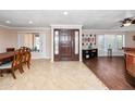 Inviting entryway with a dark wood front door and neutral tile flooring at 11820 S Half Moon Dr, Phoenix, AZ 85044