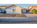 Inviting single-story home showcasing desert landscaping and a long driveway, perfect for parking at 1360 W Folley St, Chandler, AZ 85224