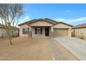 Inviting single-story home featuring desert landscaping, covered porch, and a two-car garage at 2540 E Atlanta Ave, Phoenix, AZ 85040