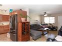 Open floor plan showcasing an eat-in kitchen connecting to a cozy living area with natural light at 3227 W Villa Rita Dr, Phoenix, AZ 85053