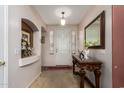 Inviting entryway with a marble table and a decorative mirror at 3588 S 257Th Ave, Buckeye, AZ 85326