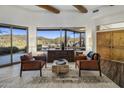 Comfortable seating area showcases a large picture window with scenic desert landscape views at 36102 N Creek View Ln, Cave Creek, AZ 85331