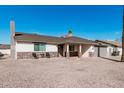 Charming home with desert rock, stone accents, covered entry and a well-manicured lawn at 4720 N 63Rd Ave, Phoenix, AZ 85033