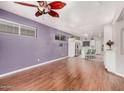 Inviting living room featuring wood-look flooring with view of the kitchen at 6001 E Southern Ave # 68, Mesa, AZ 85206