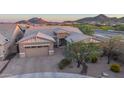 Beautiful home with manicured landscaping, mountains, and a three-car garage at 6515 W Copper Springs Rd, Phoenix, AZ 85083