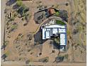 A birds-eye view of the property showing the home layout, desert landscaping, and outdoor living spaces at 13935 E Smokehouse Trl, Scottsdale, AZ 85262