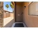 Front door with a 'no soliciting' sign and a view of the landscaped yard at 20840 E Vía Del Palo --, Queen Creek, AZ 85142