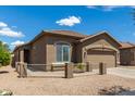 This single-story home features a well-maintained exterior and a two-car garage at 20840 E Vía Del Palo --, Queen Creek, AZ 85142