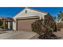 Single Gathering home with two car garage and desert landscaping at 27044 W Escuda Dr, Buckeye, AZ 85396