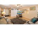 Cozy living room featuring neutral paint, ceiling fan, and comfortable seating arrangement at 2801 N Dakota St, Chandler, AZ 85225