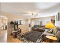 Relaxing living room featuring a large window, ceiling fan, and comfortable seating at 2801 N Dakota St, Chandler, AZ 85225