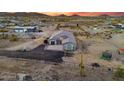 Aerial view shows desert home with large lot, metal fencing, and a few cacti at 3002 W Josiah Trl, Queen Creek, AZ 85144