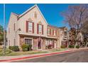 Street view of townhouses featuring brick and siding with colorful shutters at 3334 W Morrow Dr # 3, Phoenix, AZ 85027