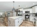 Bright, modern kitchen with stainless steel appliances and a marble-topped center island at 4381 N 86Th St, Scottsdale, AZ 85251