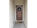 Inviting front entrance with a decorative wreath and a 'hello' doormat at 7234 E Eagle Nest Way, San Tan Valley, AZ 85143