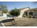 An eye-level shot of the front of a home with desert landscaping and a concrete driveway at 10960 E Monte Ave # 154, Mesa, AZ 85209