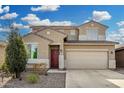 Home featuring a desert landscape, paver driveway, and a two-car garage at 11509 W Boca Raton Rd, El Mirage, AZ 85335