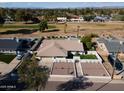 Aerial view of a well-maintained home with a pool and an expansive golf course in the backyard at 120 W Thunderbird Rd, Phoenix, AZ 85023