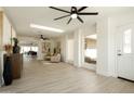 Bright living room with neutral colors, modern decor, skylight and wood-look flooring at 120 W Thunderbird Rd, Phoenix, AZ 85023