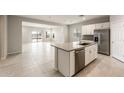 Modern kitchen featuring an island with stainless steel appliances and ample counter space at 17851 W Getty Dr, Goodyear, AZ 85338