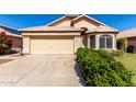 Charming single-story home with a two-car garage, desert landscaping, and a tile roof at 18525 N 85Th N Ave, Peoria, AZ 85382