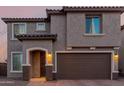 Charming two-story home with a two-car garage and covered entryway at 19703 W Badgett Ln, Litchfield Park, AZ 85340