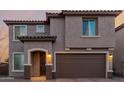 Charming two-story home with a two-car garage and covered entryway at 19703 W Badgett Ln, Litchfield Park, AZ 85340