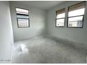 Bright bedroom featuring natural light from two large windows at 22840 E Roundup Way, Queen Creek, AZ 85142
