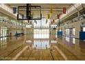 Spacious recreation center gymnasium with basketball court and banners at 2681 N Riverside Dr, Florence, AZ 85132