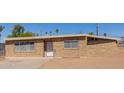 Cozy brick home featuring ample windows for natural light, and a neatly maintained front yard at 3644 W Townley Ave, Phoenix, AZ 85051