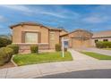 Charming single-story home with a well-manicured lawn, tile roof, and inviting curb appeal at 7654 W Congressional Way, Florence, AZ 85132