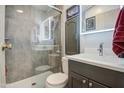 Modern bathroom featuring a glass-enclosed shower and a sleek vanity at 7750 E Broadway Rd # 475, Mesa, AZ 85208