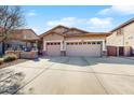 Attractive single-story home with a large driveway and a well-maintained front yard at 8385 W Vogel Ave, Peoria, AZ 85345