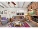 Inviting living room featuring a brick fireplace and comfortable seating at 945 W 10Th St, Mesa, AZ 85201