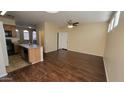 Spacious living room with wood-look floors and an open layout, perfect for entertaining and Gathering time at 10039 W Kingman St, Tolleson, AZ 85353