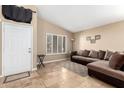 Cozy living room with large windows and neutral tones, offering a comfortable and relaxing space at 1421 E Gary Dr, Chandler, AZ 85225