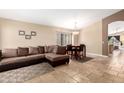 Inviting living room featuring travertine floors and a comfortable seating area at 1421 E Gary Dr, Chandler, AZ 85225